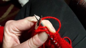 Knitting pocket and body together.